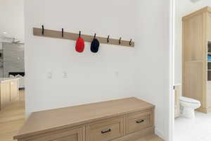 Mudroom with a premium fireplace, a ceiling fan, and recessed lighting
