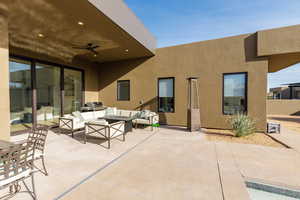 View of patio with outdoor furniture and ceiling fan