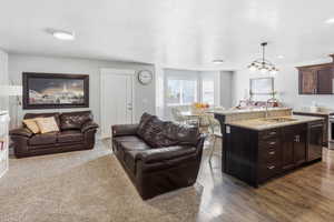 Living room with dark wood finished floors and a textured ceiling