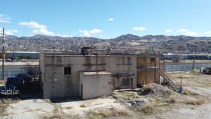 View of outbuilding featuring a mountain view and stairs
