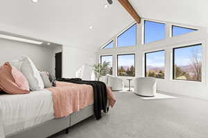 Carpeted bedroom with a mountain view