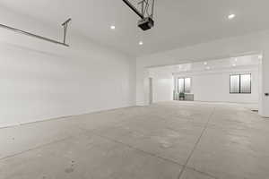 Double Deep 4 car Garage featuring recessed lighting and a garage door opener