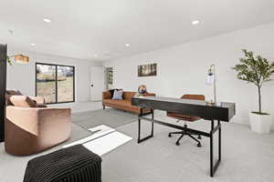 Office featuring recessed lighting and light colored carpet