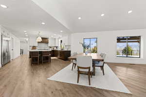 Dining space featuring light wood-style flooring and recessed lighting