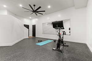 Workout room featuring ceiling fan and recessed lighting