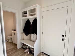 Mudroom with light wood-style floors