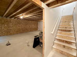 Staircase with unfinished concrete floors