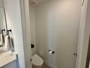 Bathroom featuring toilet and vanity