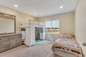 Bedroom featuring light colored carpet and recessed lighting