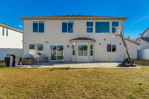 Back of property with a patio area