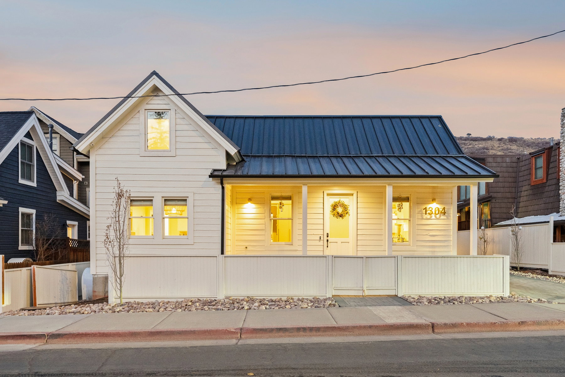 View of front of house with a porch and a standing seam roof