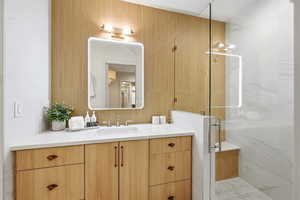 Full bath featuring vanity and a stall shower