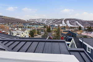 Mountain view featuring nearby suburban area