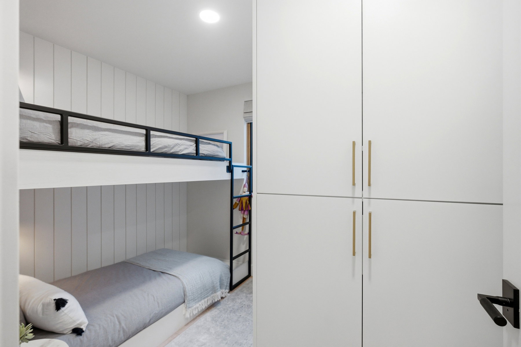 Bedroom with wood walls