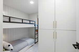 Bedroom with wood walls