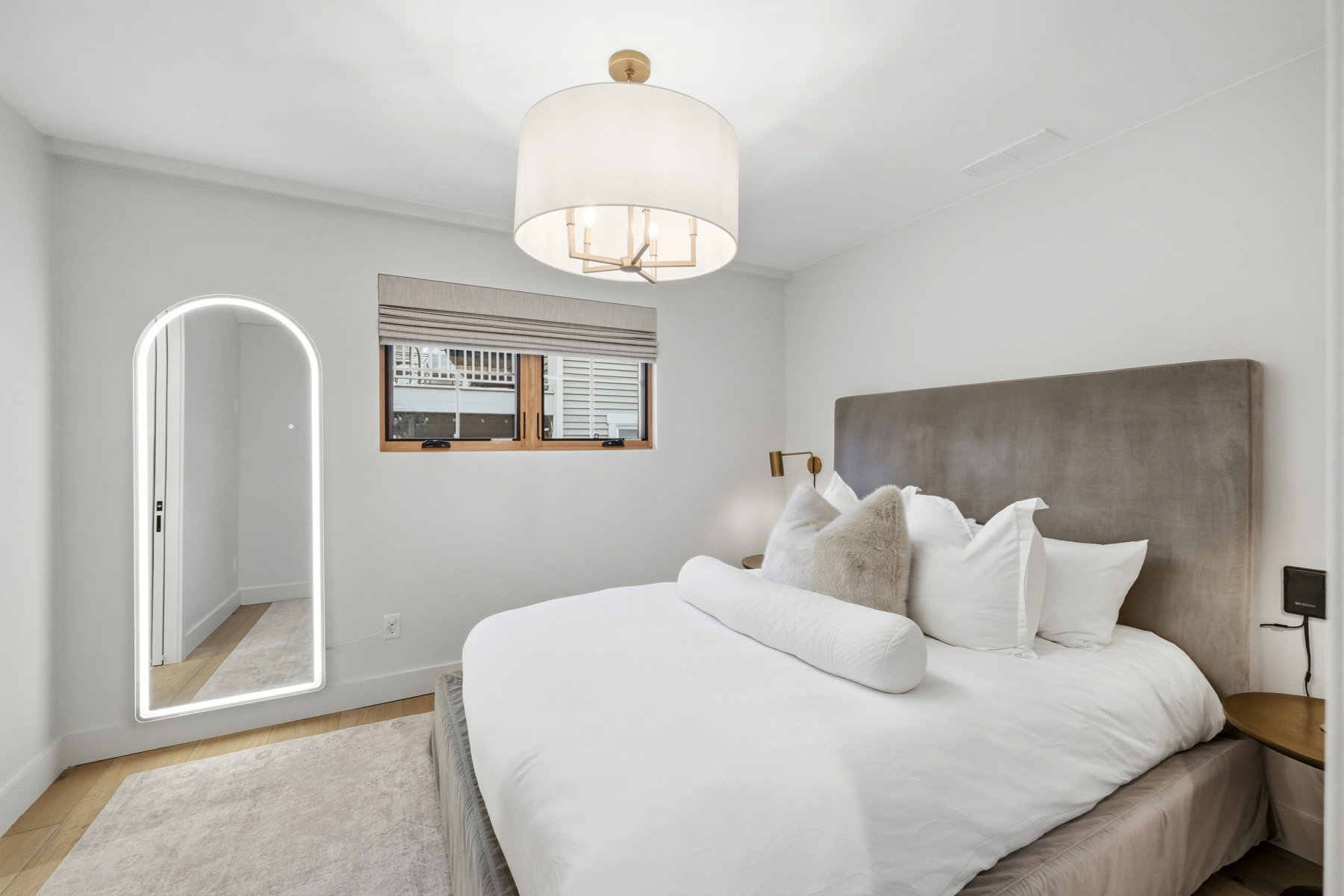 Bedroom featuring light wood finished floors and baseboards
