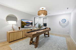 Playroom featuring light wood-style floors and recessed lighting