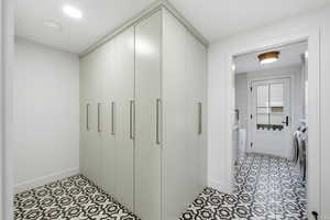 Closet with washer and clothes dryer