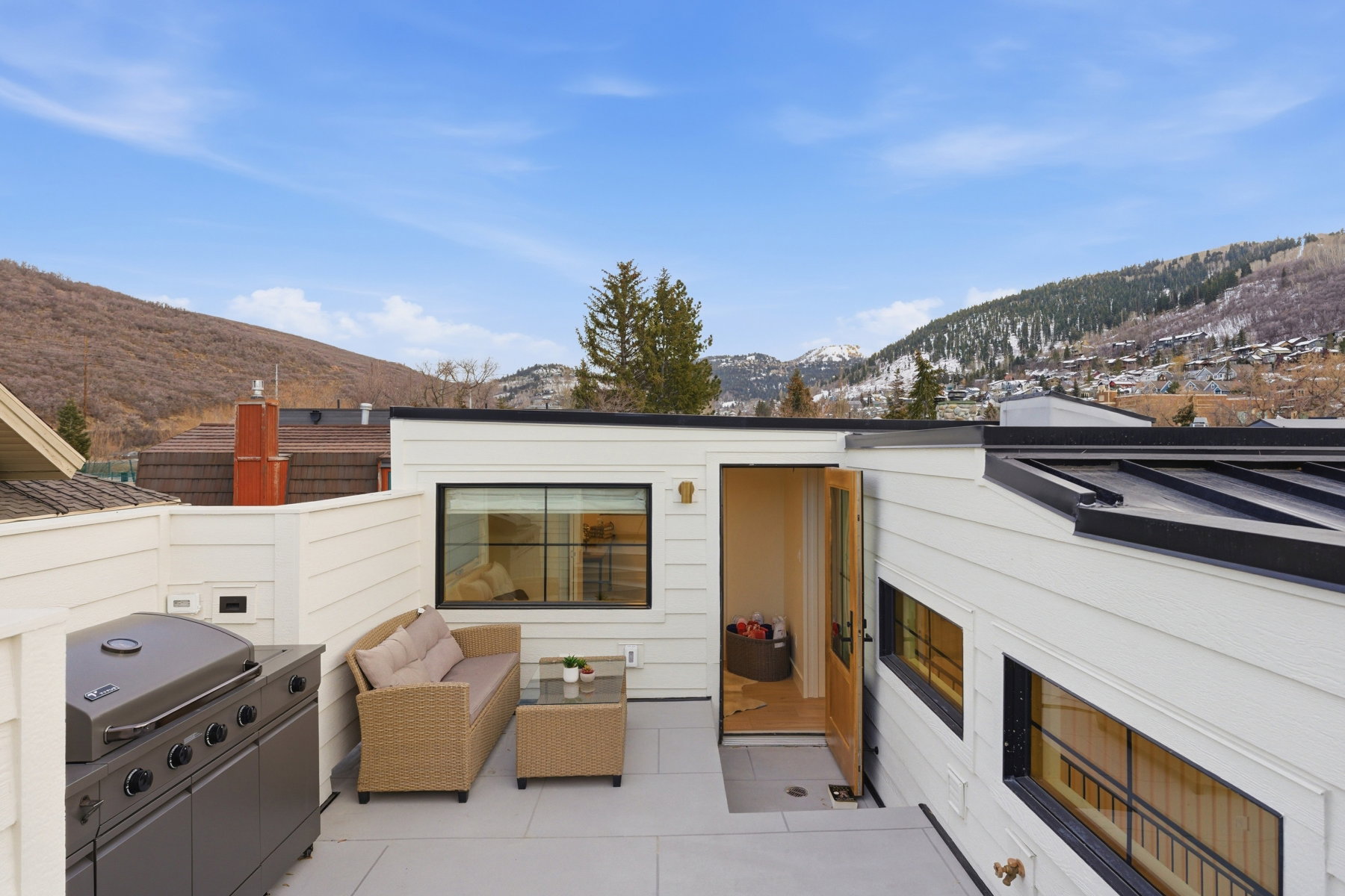 View of patio with a mountain view, an outdoor lounge area, and a grill