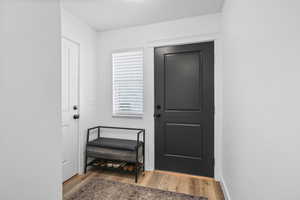 Entryway with light wood-style flooring