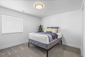 Bedroom with carpet and baseboards