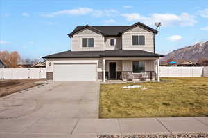 Craftsman house with a porch, a gate, concrete driveway, board and batten siding, and a garage