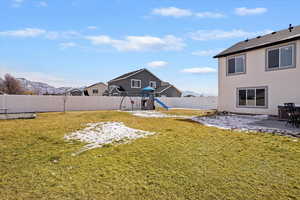 Fenced backyard with a patio, and a mountain view