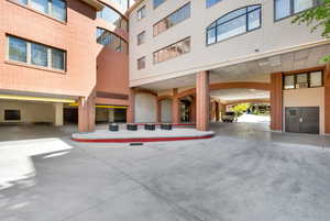 Entrance to property featuring brick siding