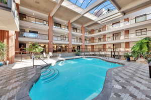 Community pool and spa with a skylight
