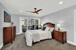 Master Bedroom with access to sitting area, ceiling fan, carpet flooring, and recessed lighting