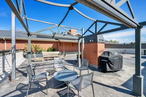 Roof Top View of patio / terrace featuring a grill and an outdoor lounge area
