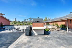 Roof Top View of patio / terrace featuring a grill