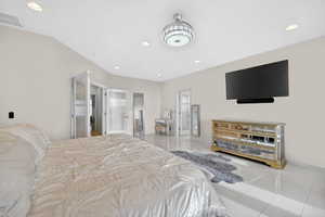 Bedroom featuring light tile patterned flooring and recessed lighting