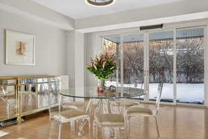 Dining area with light wood-type flooring
