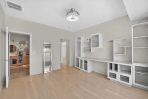 Unfurnished bedroom with light wood-style floors