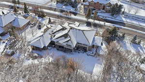 Snowy aerial view featuring a residential view