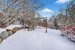 View of yard covered in snow