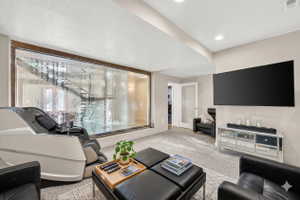 Living area featuring light colored carpet