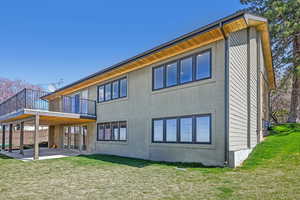 Rear view of house featuring a patio and stucco siding
