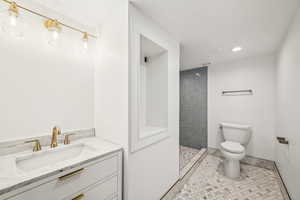 Basement 3/4 bathroom. designer tile, extra storage, recessed lights.