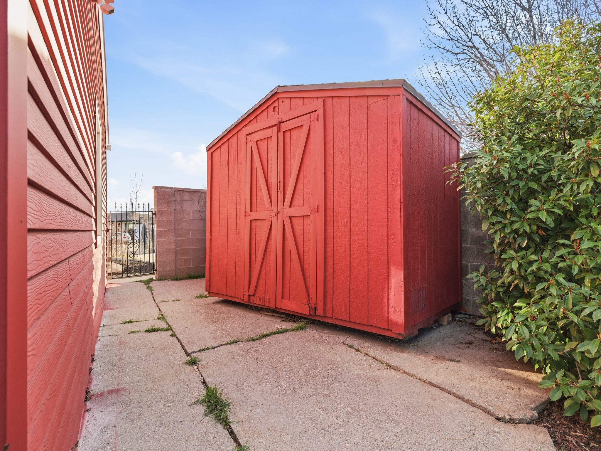 View of shed featuring a gate