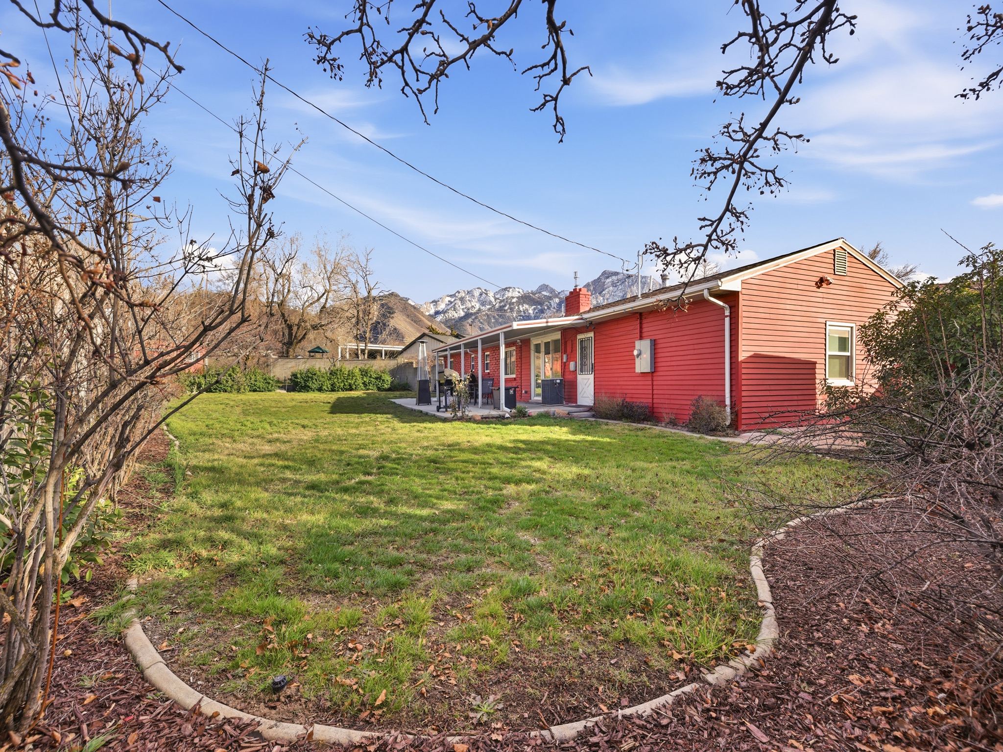 View of green lawn featuring a patio area