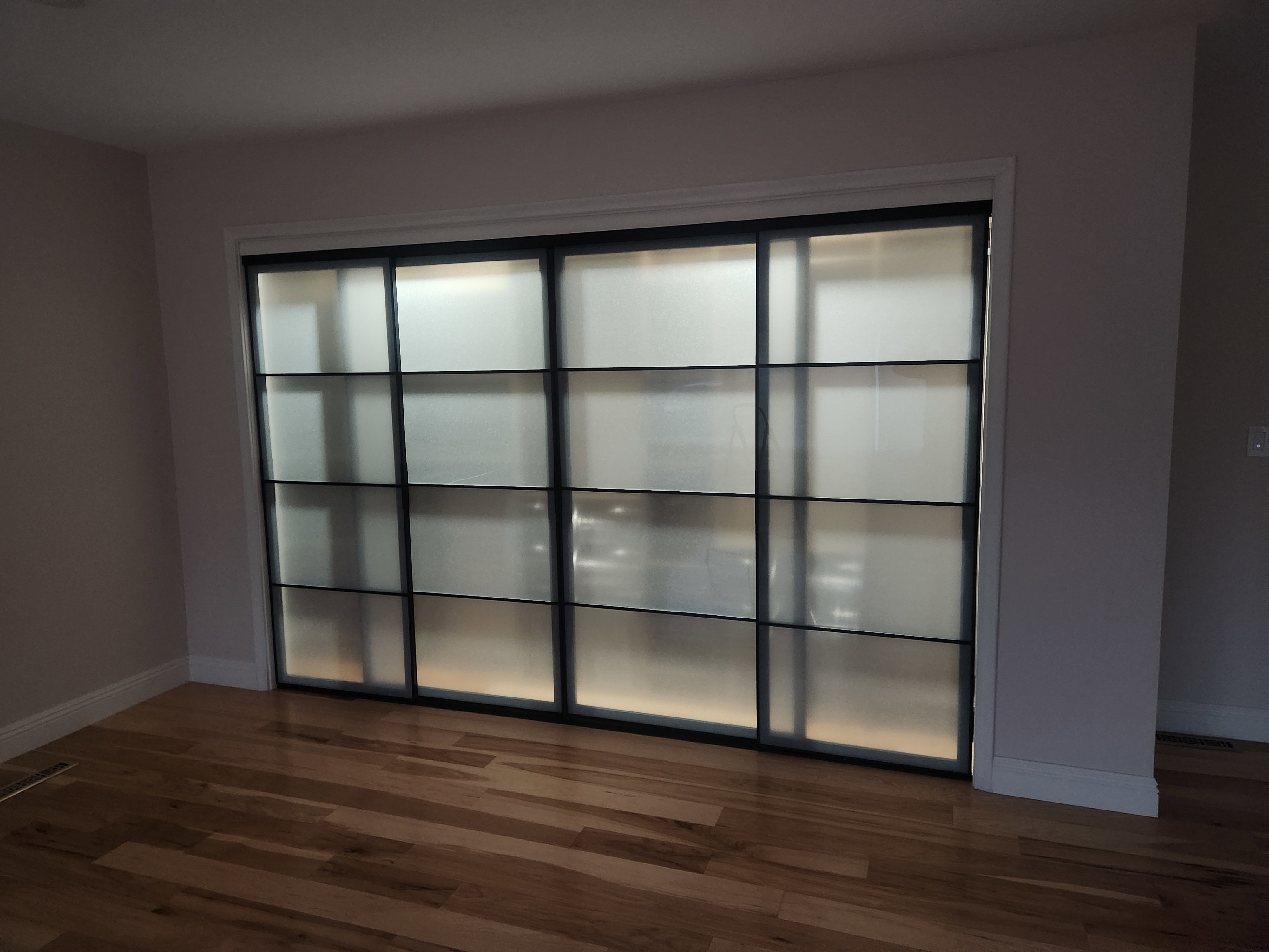 Empty room featuring dark wood-style floors