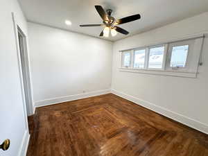 Spare room featuring parquet flooring, ceiling fan, recessed lighting, and crown molding