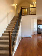 Stairs featuring wood-type flooring and baseboards