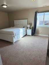 Bedroom with light carpet
