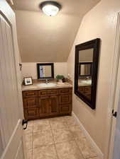 Bathroom with vanity and light tile patterned floors