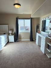 Unfurnished bedroom with light carpet