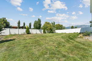 View of fenced backyard