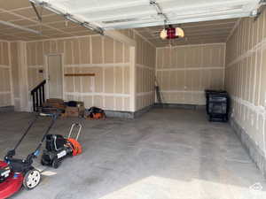 Garage featuring a garage door opener